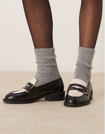 Kyden penny loafers in black and off white