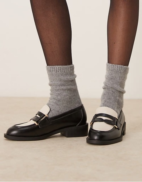 Kyden penny loafers in black and off white