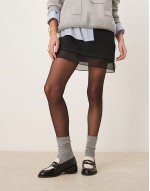 Kyden penny loafers in black and off white